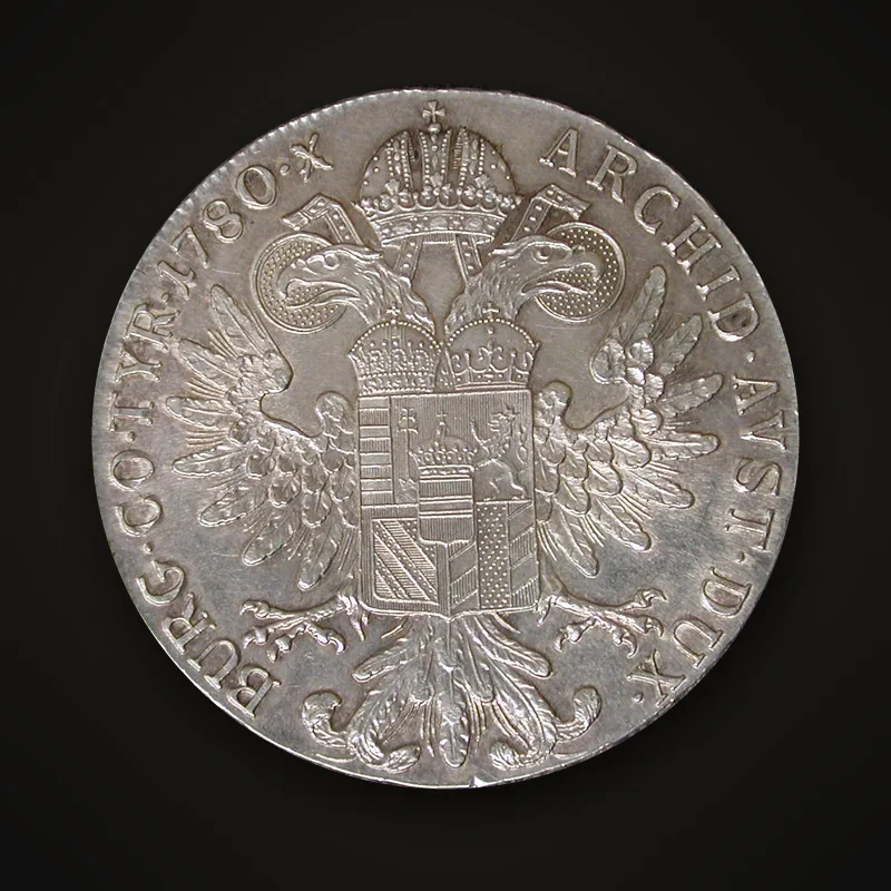 Thaler de Marie-Thérèse daté 1780, revers : aigle bicéphale couronné portant l’écu des Habsbourg